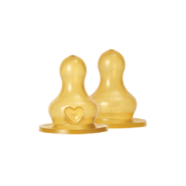 Two BIBS Baby Bottle Nipple Round Latex Medium Flow teats in yellow, with heart and BIBS embossed, on white background.