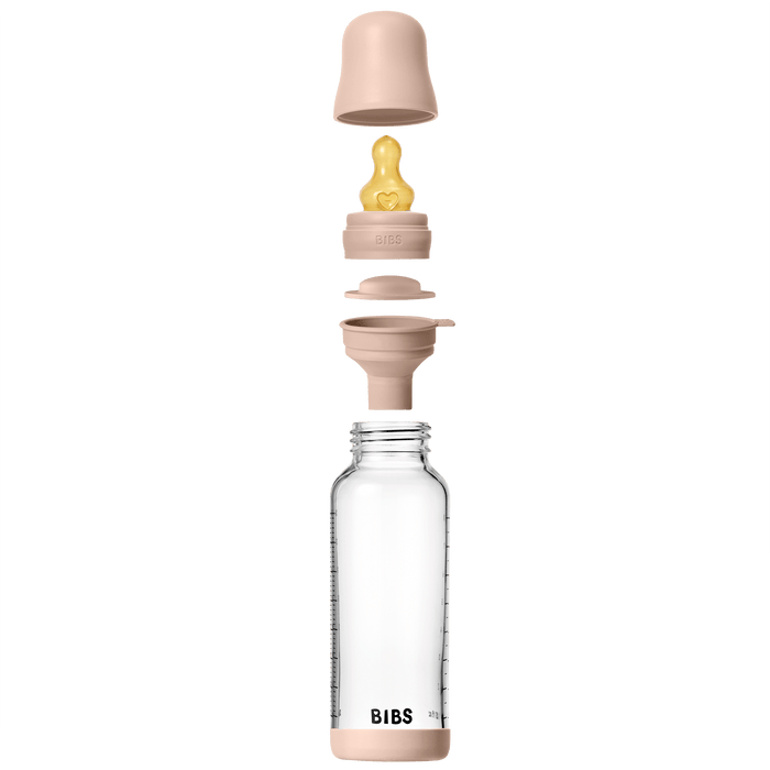 BIBS Glass Baby Bottle 240ml blush components exploded view: clear glass bottle, blush collar, latex teat, ring and cap on white background.