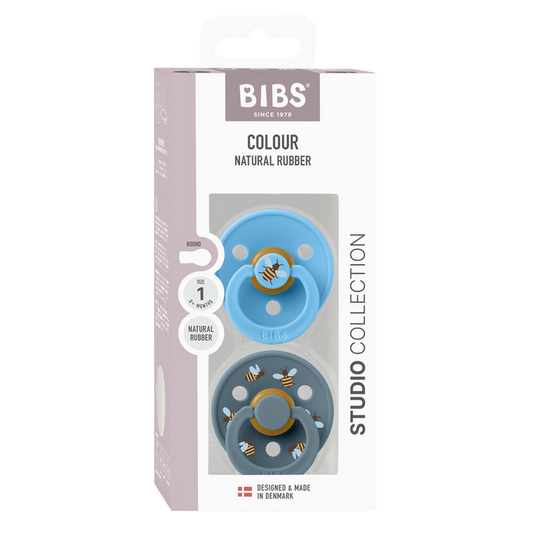 BIBS Studio Colour 2 Pack Bumblebee pacifiers in blue and slate, Size 1, Natural Rubber, white box with bee print design