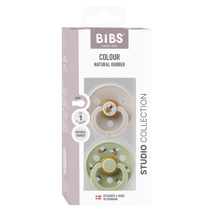 BIBS Studio Colour 2 Pack Bumblebee Size 1 pacifiers in blush and sage, bee print, natural rubber, white background