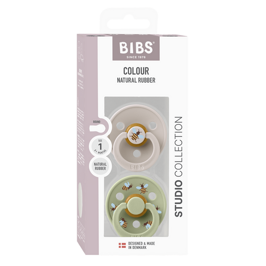 BIBS Studio Colour 2 Pack Bumblebee Size 1 pacifiers in blush and sage, bee print, natural rubber, white background