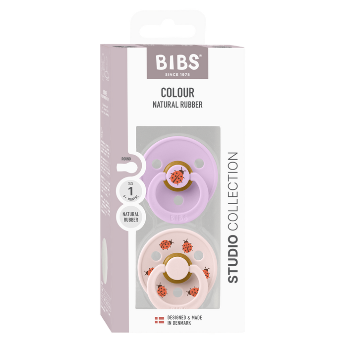 BIBS Studio Colour 2 Pack Ladybug pacifiers, violet and blush pink, ladybug print, Size 1, white box background.