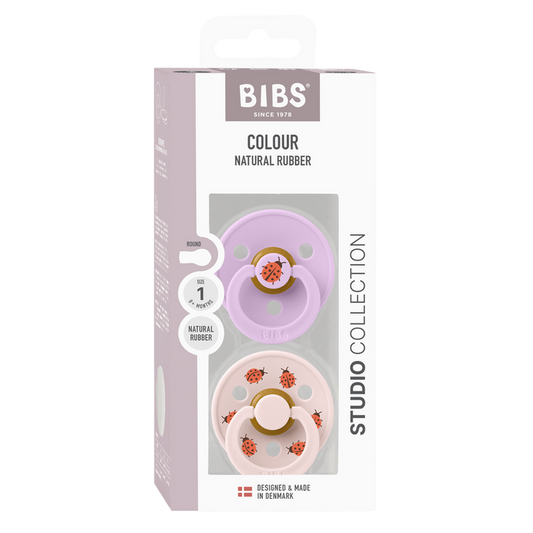 BIBS Studio Colour 2 Pack Ladybug pacifiers, violet and blush pink, ladybug print, Size 1, white box background.