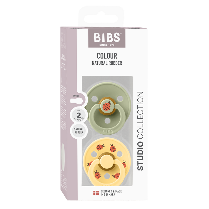 BIBS Studio Colour 2 Pack Ladybug Latex Size 2 Sage Mix pacifiers in sage and yellow with ladybug prints, white background