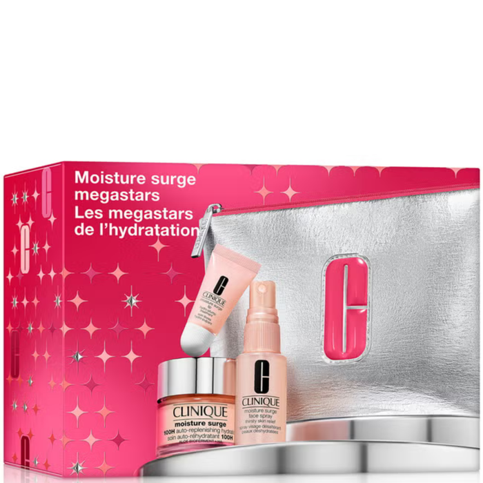 Clinique Moisture Surge Megastars 3 Piece Set in pink box with silver cosmetic bag, moisturizer, face spray, and eye cream on white background.