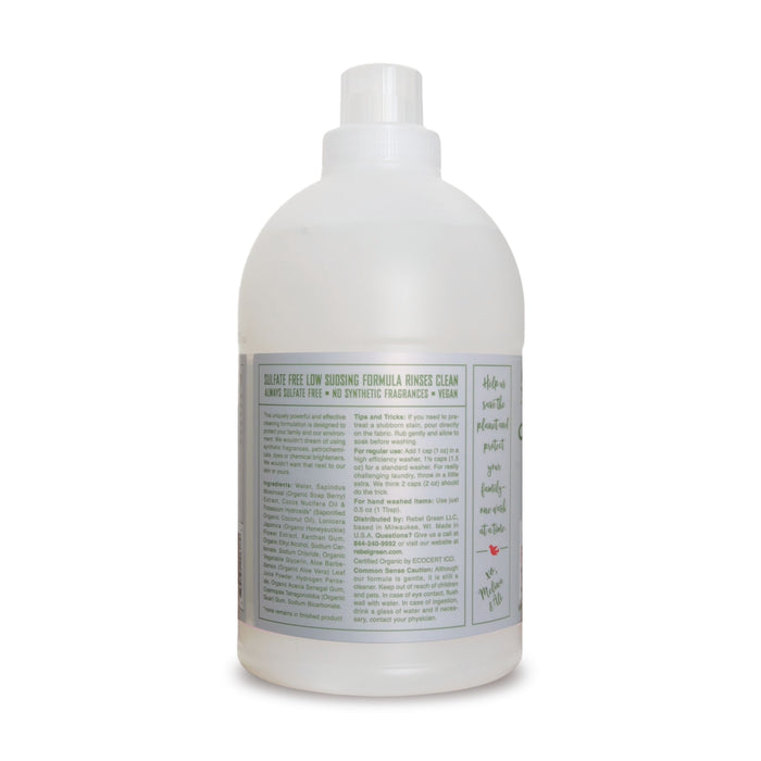 A bottle of Rebel Green Fresh Laundry Detergent Liquid - 3x Concentrated features a white cap, mostly white label, and highlights gentle, sulfate-free, low-sudsing, vegan ingredients. The back label displays detailed product information.