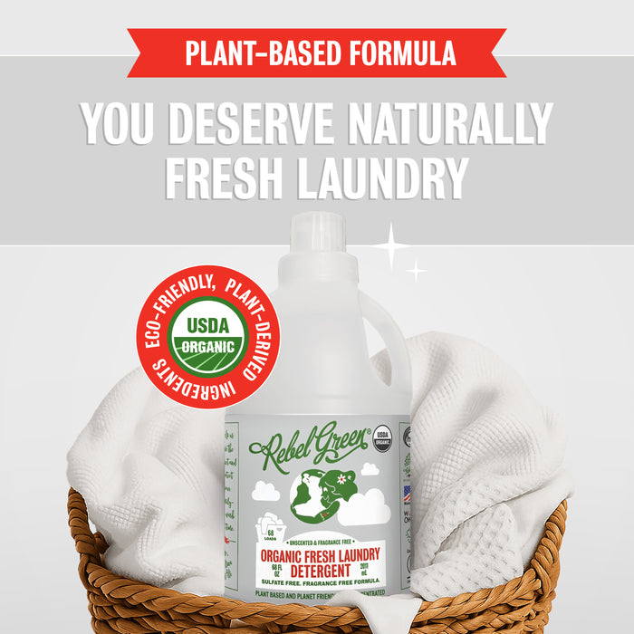 A Rebel Green Fresh Laundry Detergent Liquid - 3x Concentrated bottle sits in a wicker basket with white towels. Text reads: "You deserve naturally fresh laundry" and highlights its gentle, plant-derived, eco-friendly formula.