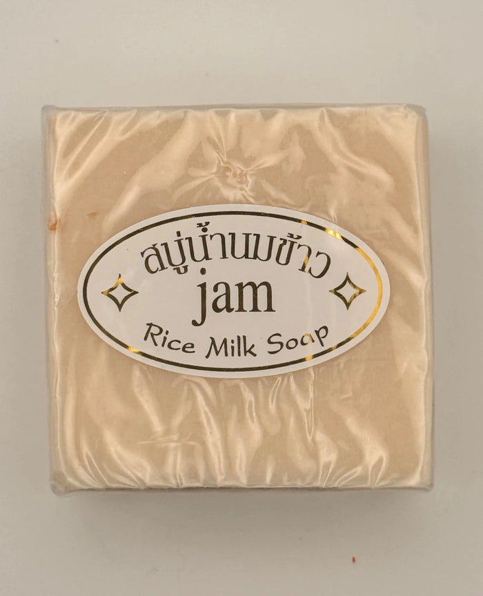 "Jam Rice Milk Soap bars unwrapped showing creamy rice milk texture for brightening face and body"