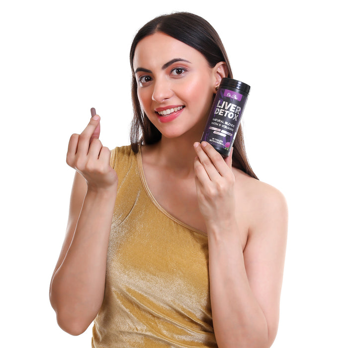 Woman holding a supplement bottle labeled 'Liver Detox' on a white background
