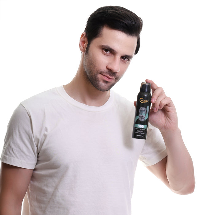 Man holding a hair spray can on a white background