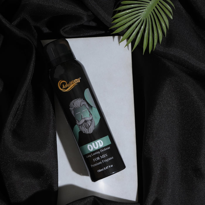 Men's deodorant spray bottle with brand logo on a black fabric background