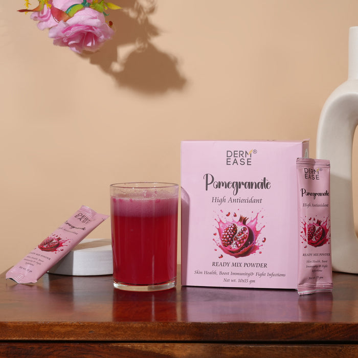 Dern Ease Pomegranate high antioxidant ready mix powder with a glass of juice on a wooden surface.