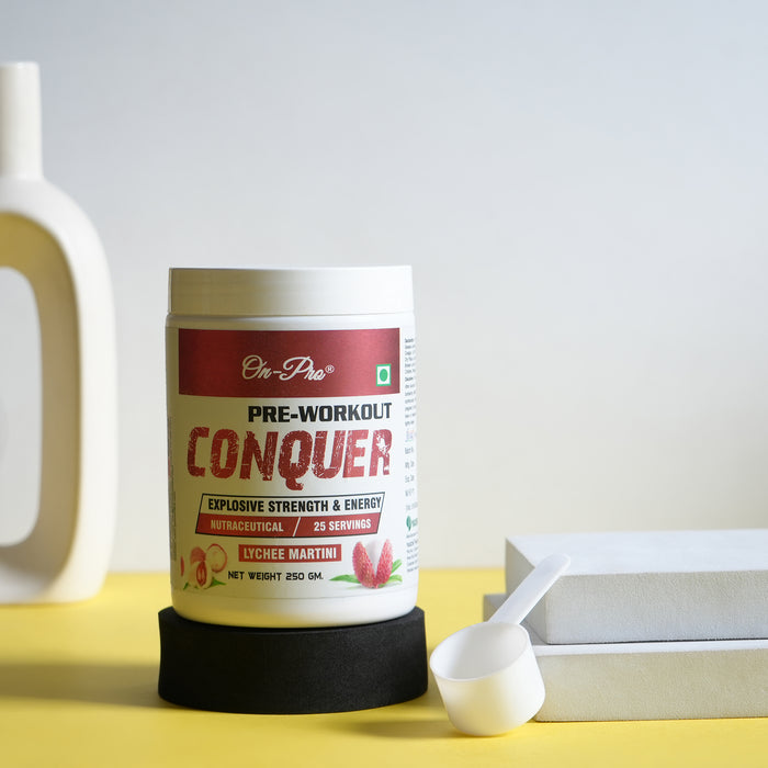 Pre-workout supplement container labeled 'Conquer' on a yellow surface with a white background