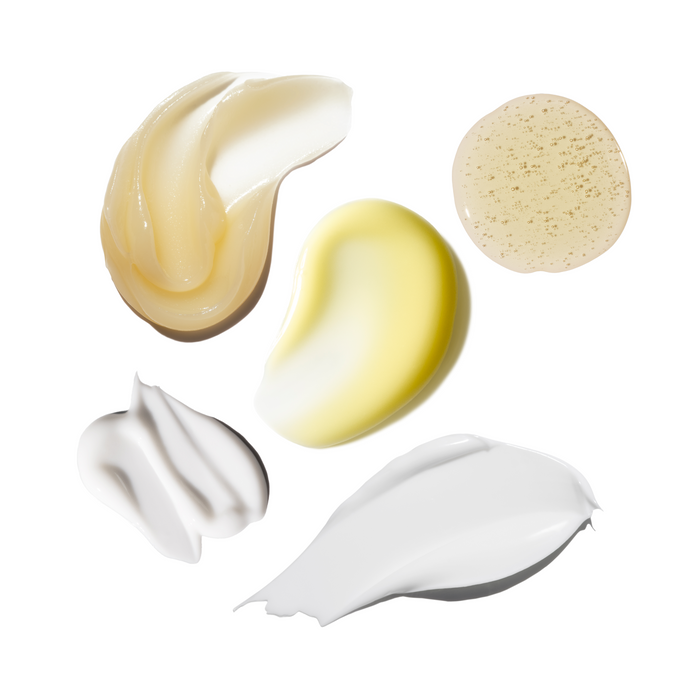 Various swatches of skincare on a white background